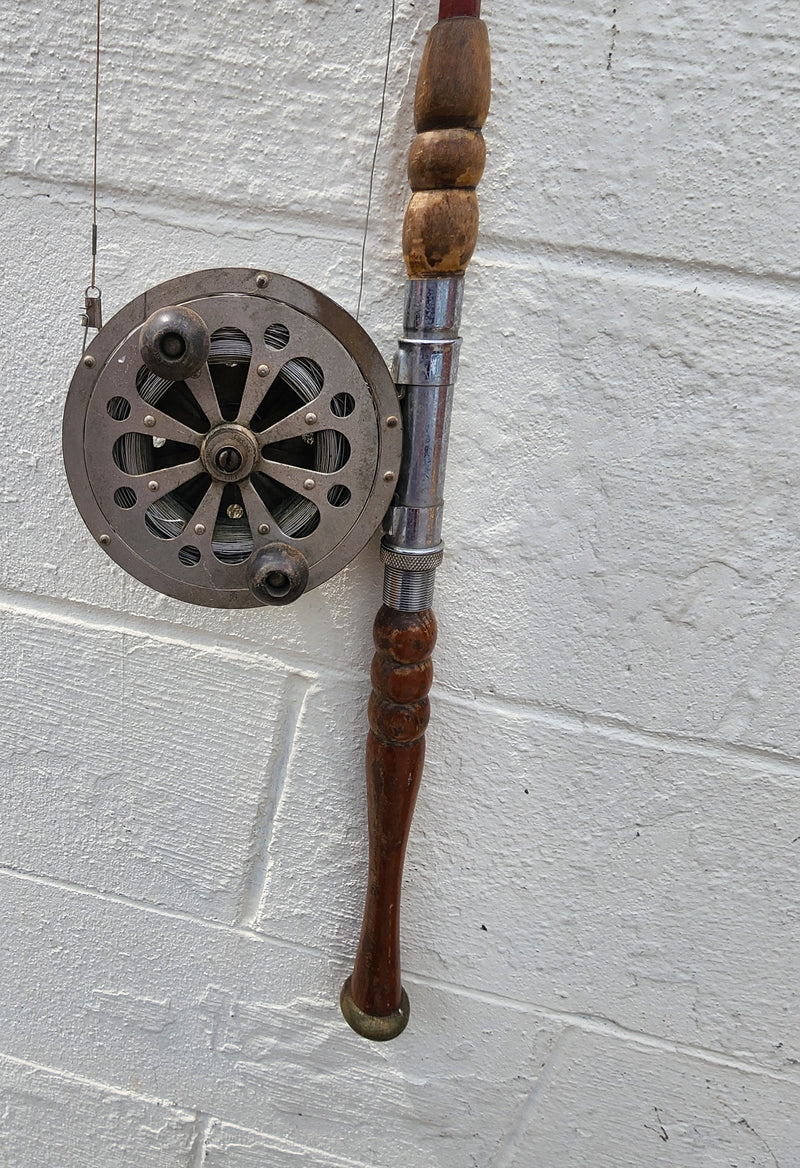 Collection of Vintage Fishing Poles and Reels