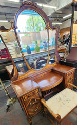 Antique wood inlay vanity with mirror and bench.