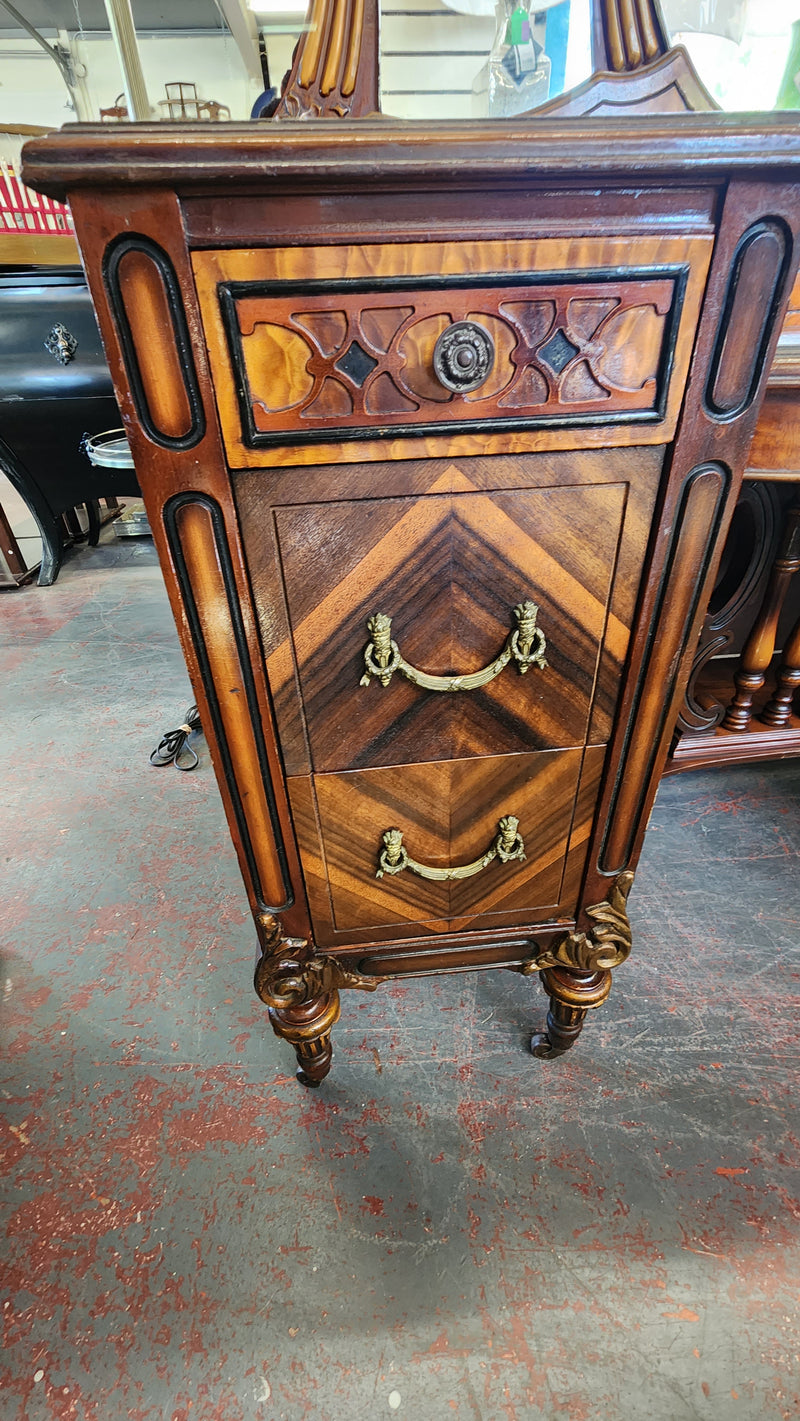 Antique wood inlay vanity with mirror and bench.