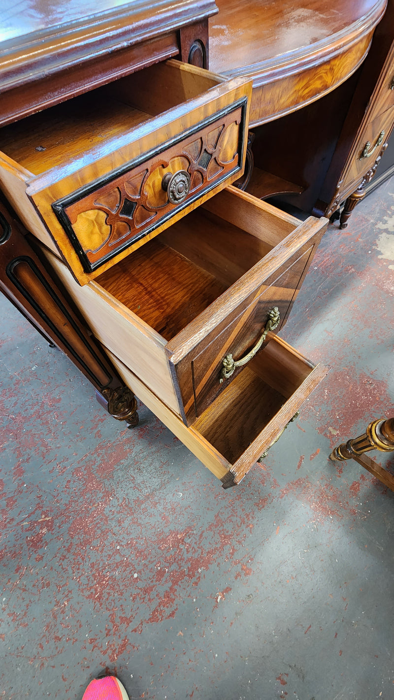 Antique wood inlay vanity with mirror and bench.