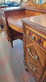 Antique wood inlay vanity with mirror and bench.