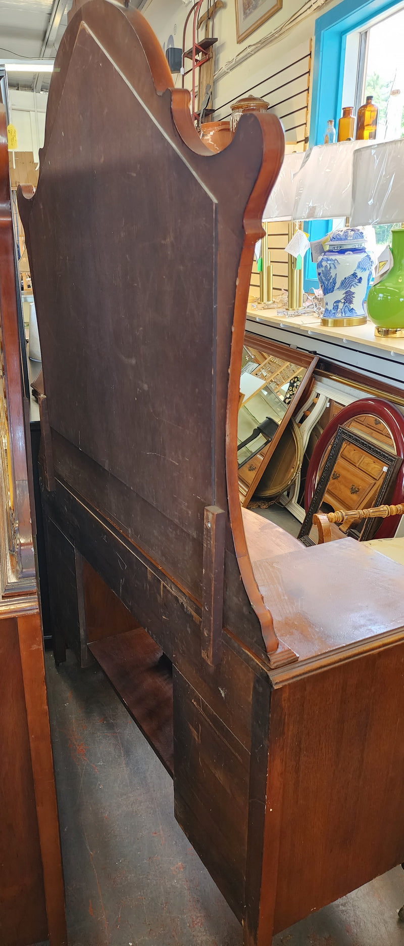 Antique wood inlay vanity with mirror and bench.